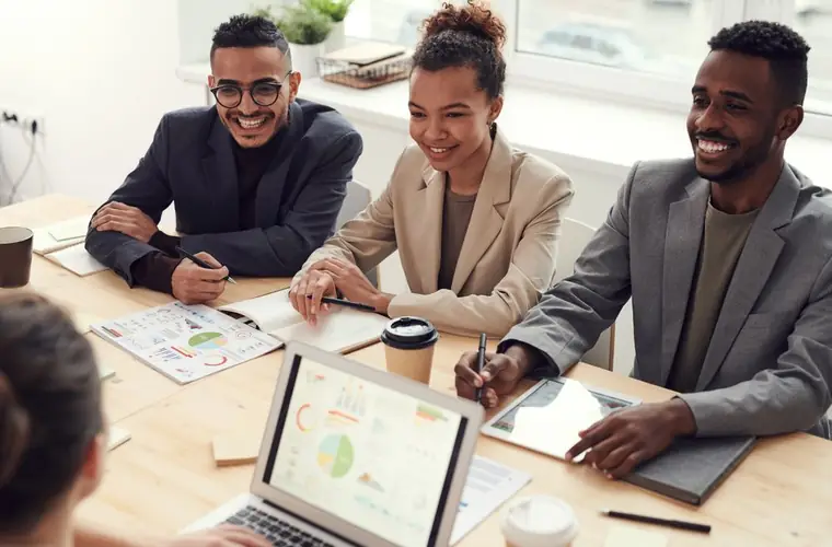 A business team reviewing reports together