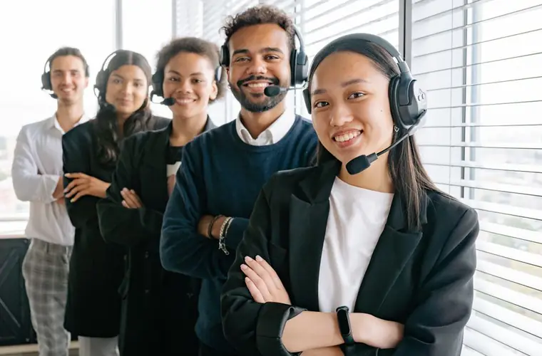 A technical support team wearing headsets