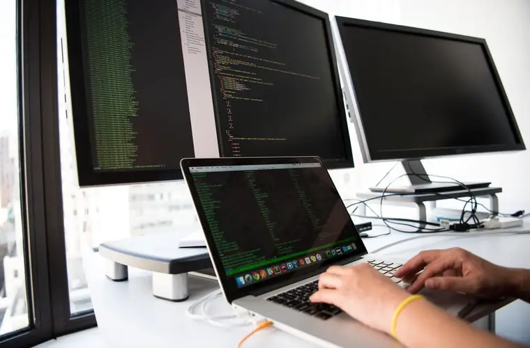 A multi-monitor software development workstation